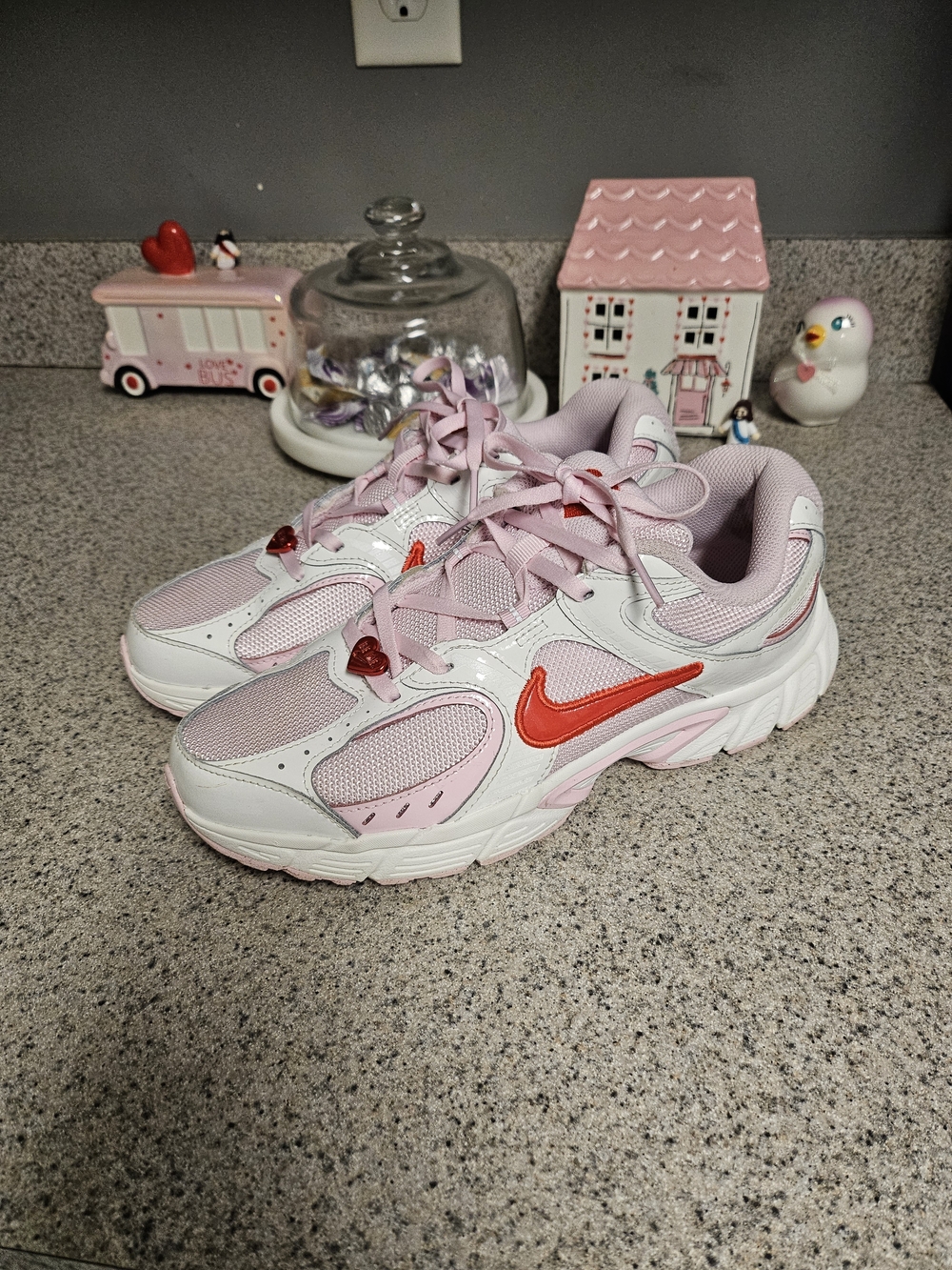 Nike Kids' Pink and White Athletic Sneakers with Red Swoosh